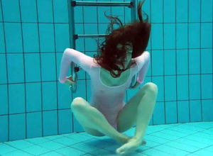 Virgin doll loses a bikini in the pool